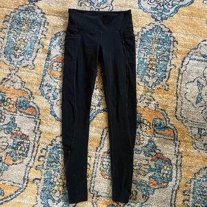Athleta Ultimate Stash full length black tights leggings pockets zipper ankle